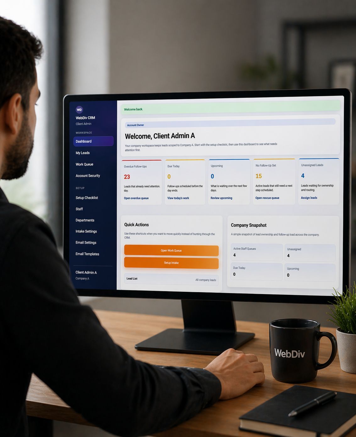 Business owner reviewing CRM dashboard and lead tracking system on desktop computer